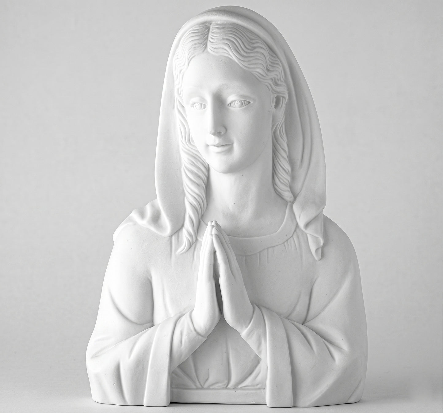 Compra este busto de la Virgen Rezando en marmolina de 29 cm. Relieve de alta resistencia exterior, ideal para pegar en lápidas, nichos y panteones. Envío seguro.
