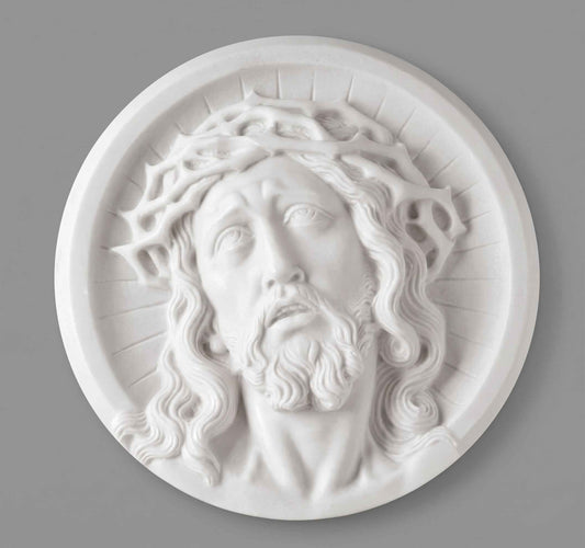 Medallón de marmolina con rostro de Cristo para la decoración de lápidas. Disponible en 10, 14 y 21 cm. Apto para cementerios.