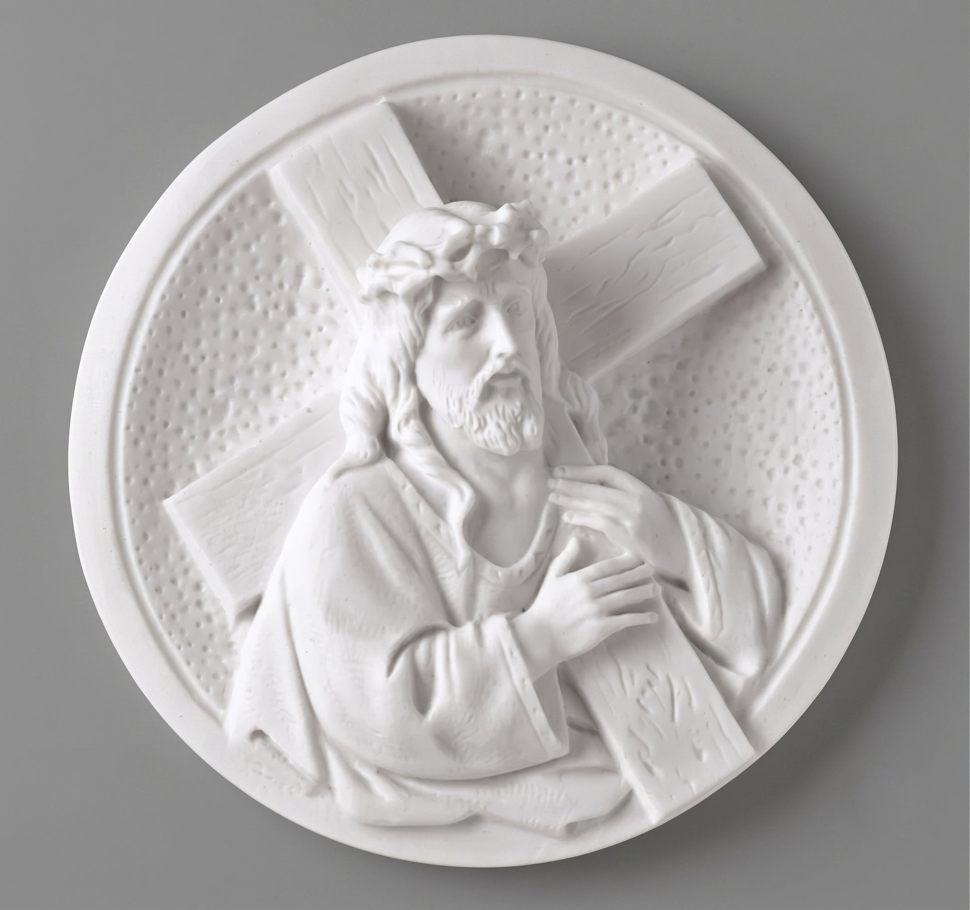 Medallón de marmolina de Jesús Nazareno para la decoración de lápidas. Disponible en 14 y 19 cm. Apto para cementerios y uso exterior.