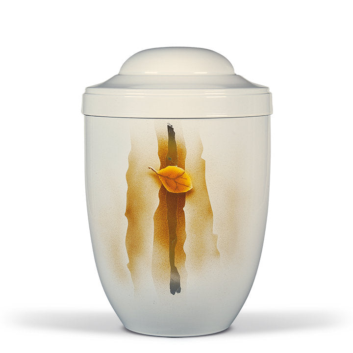 Urna funeraria económica modelo 3250 en acero color blanco cremoso con detalles de hojas metalizadas, elementos de cristal y acabado pintado a mano.