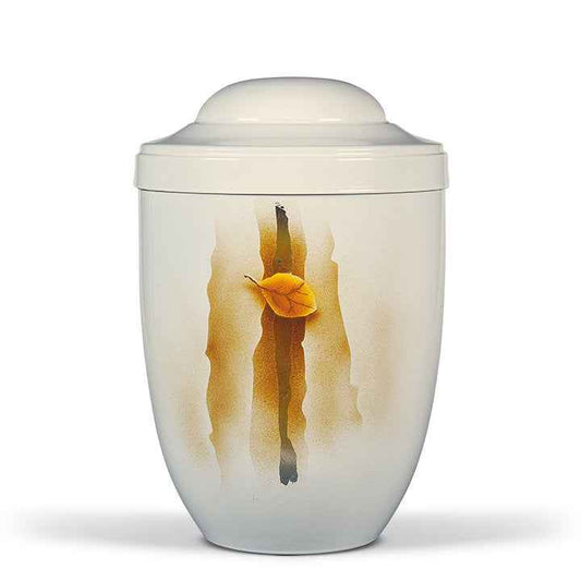 Urna funeraria económica modelo 3250 en acero color blanco cremoso con detalles de hojas metalizadas, elementos de cristal y acabado pintado a mano.